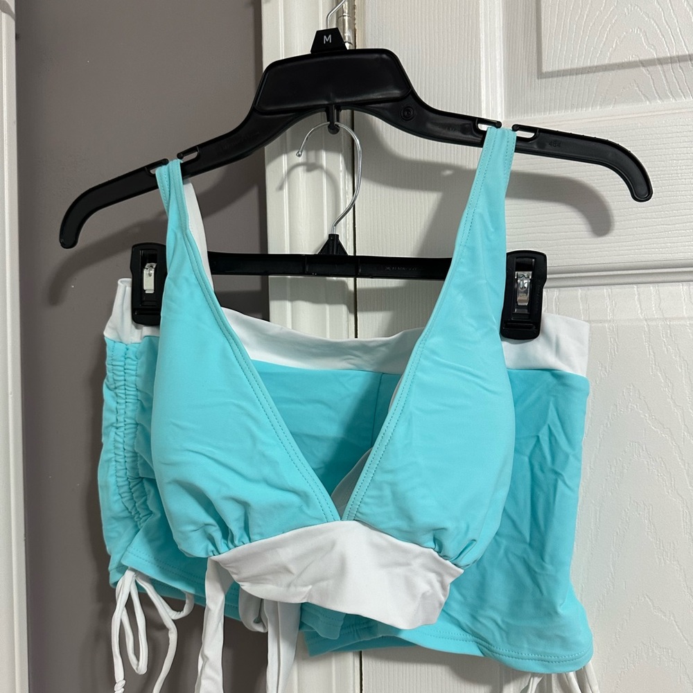 New Adorable, two-piece swim size XL. Brand new without tags.